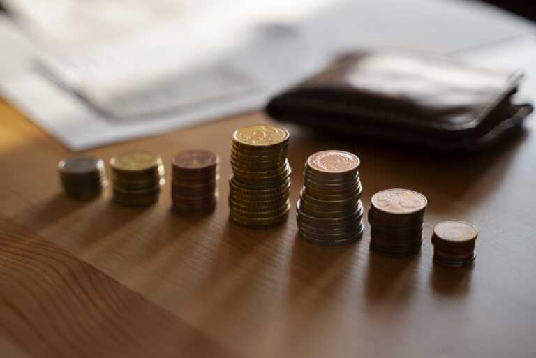 close up coins saved energy crisis expenses