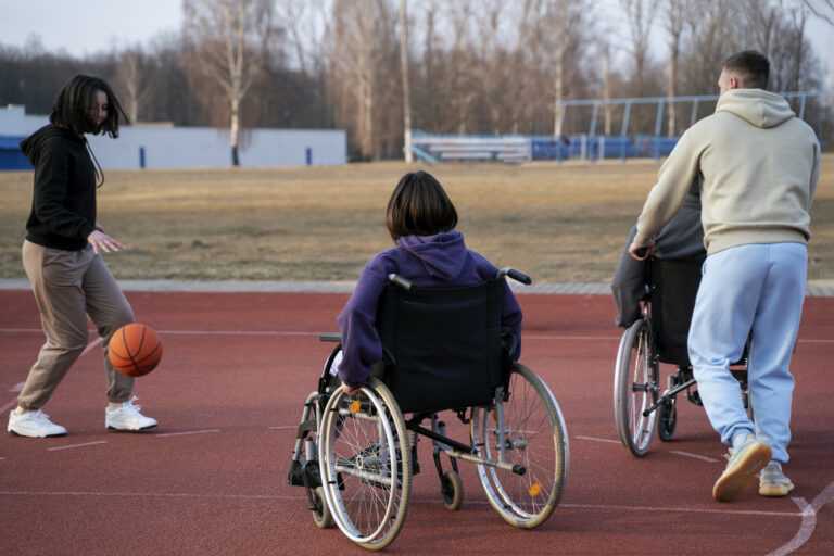 full shot friends playing basketball together