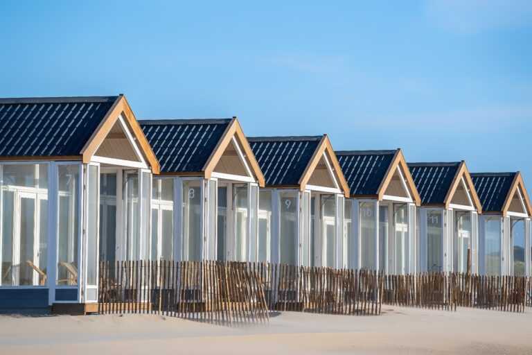 Beautiful shot of resting cabins on a sand beach